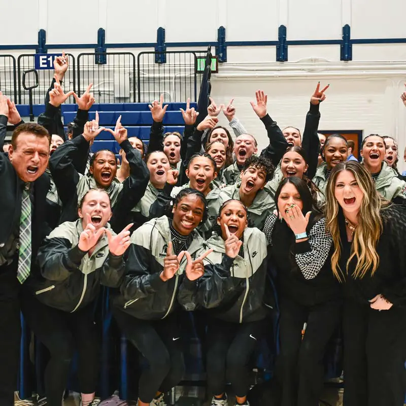 Michigan State gymnasts celebrating their championship victory